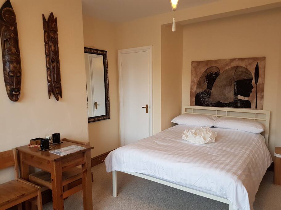 Bed, walk in wardrobe, mirror, café table