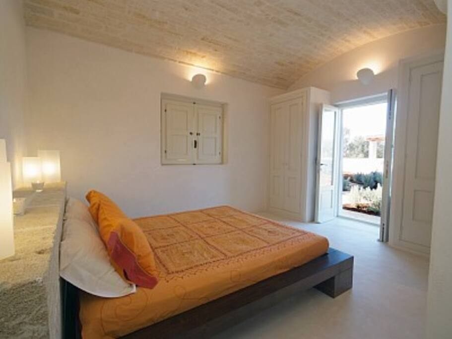 large en-suite double with french doors to pool