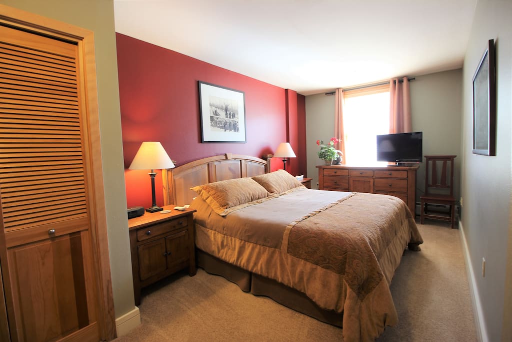 Sleep Number king master with end tables, lamps, dresser and flat screen TV with HD cable.