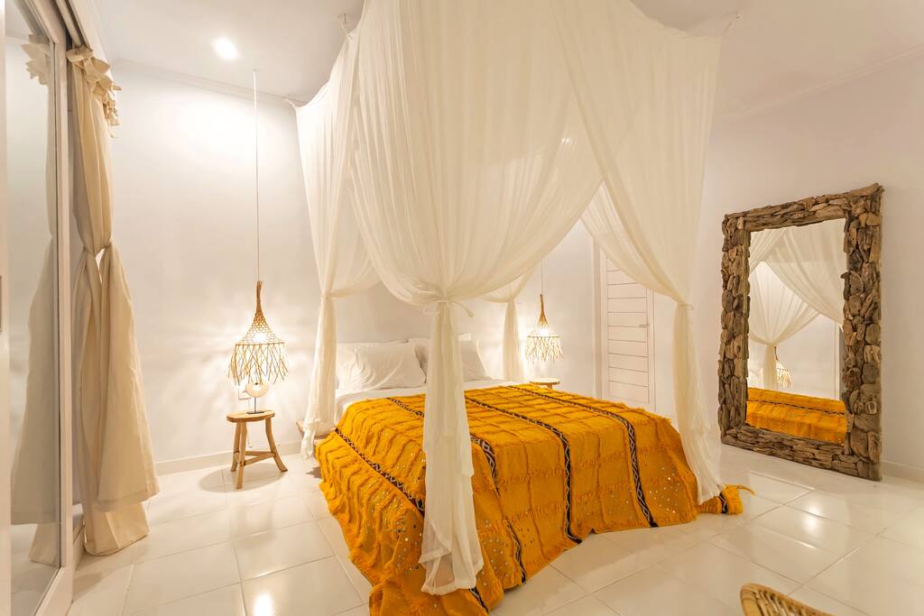 Room 3 - comfortable bed with 4 pillows and a unique mosquito net