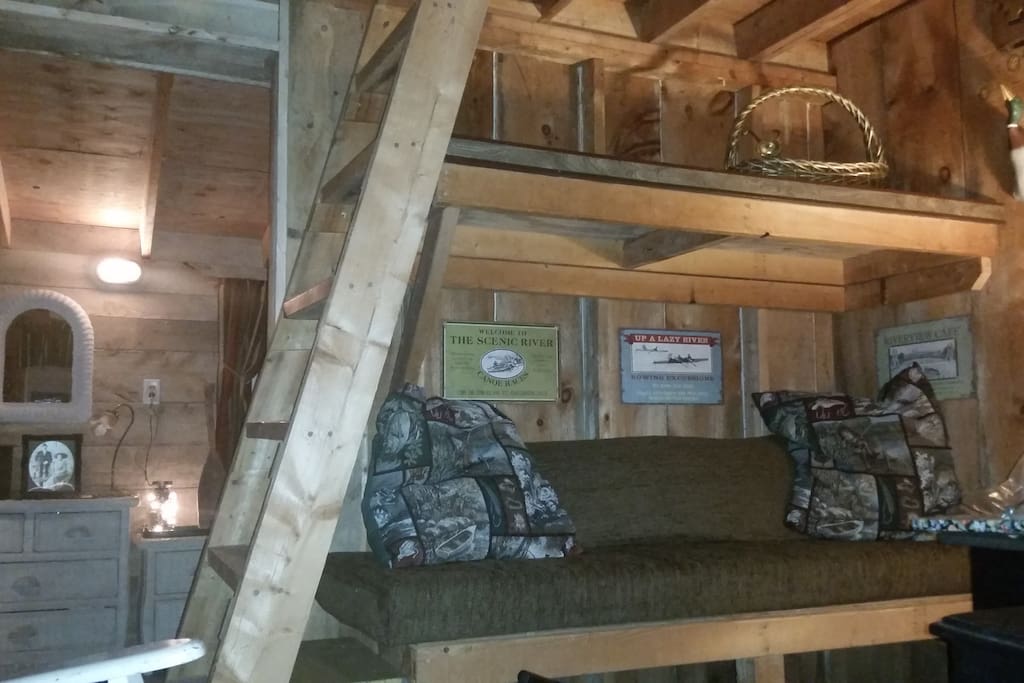 A sitting area bunk is undersized but perfect for naps. A television with internet set- up is in the sitting area. For the limber, a ladder leads to the loft and to one double bed.