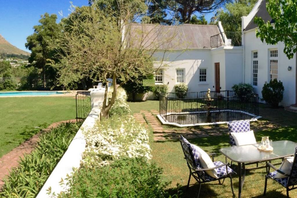 Plenty of space to relax. Lawn, pool and courtyard on the river side of the house.