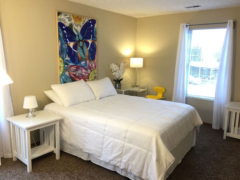 "A very cozy bedroom with a walk in closet connecting to the bathroom (a pretty nice touch in planning the space). I'm definitely staying here whenever I come back to Columbus and would highly recommend it to business and leisure travelers"