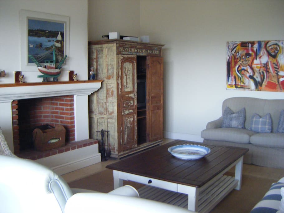 Formal lounge with TV & fireplace