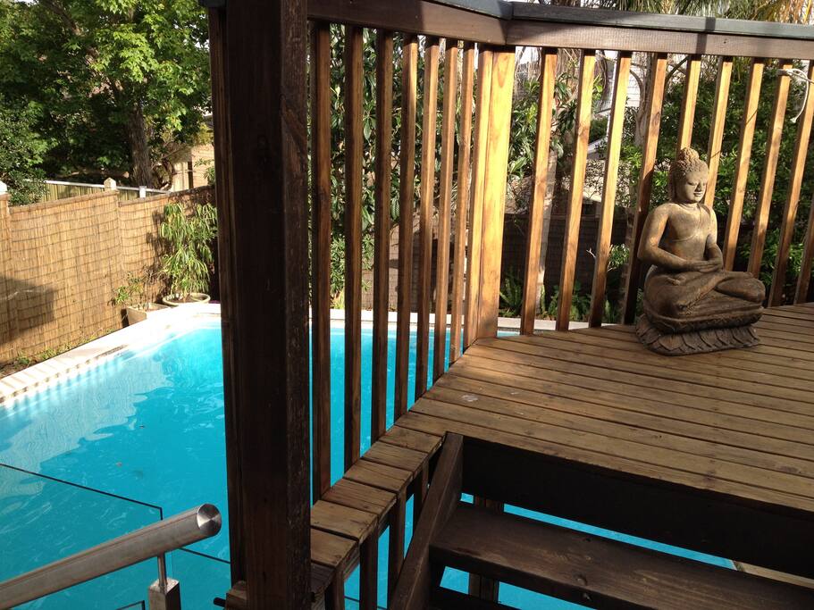 Balinese style beach house with large salt water pool with glass safety fence