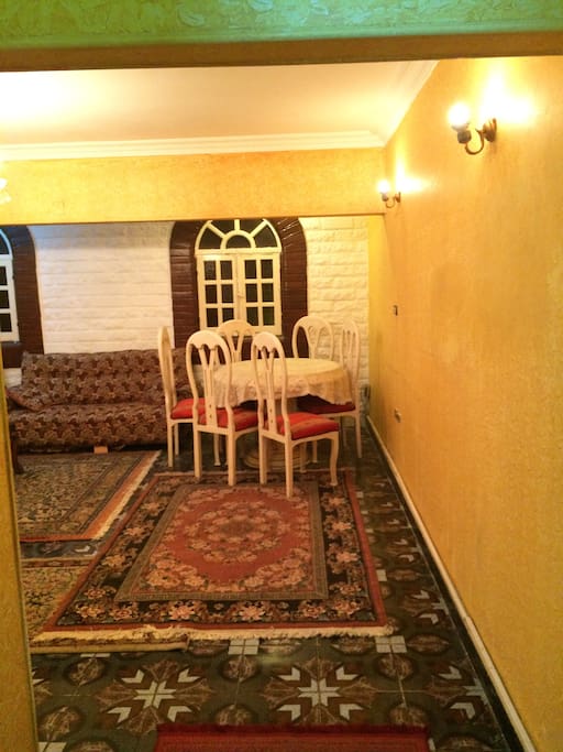 A dining table with 5 chairs