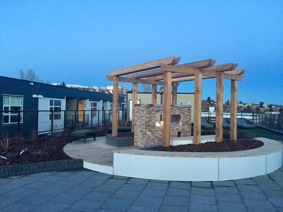 Roof top patio fireplace and seating.