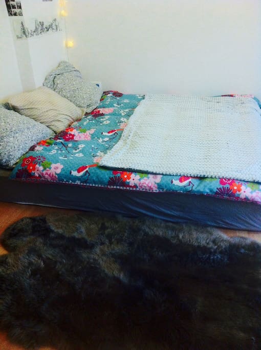 King size bed and sheep skin fur
