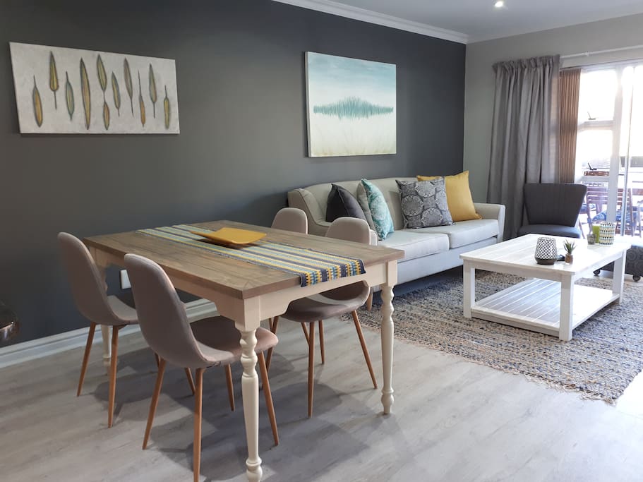 Inside dinning and living area with Tv.
