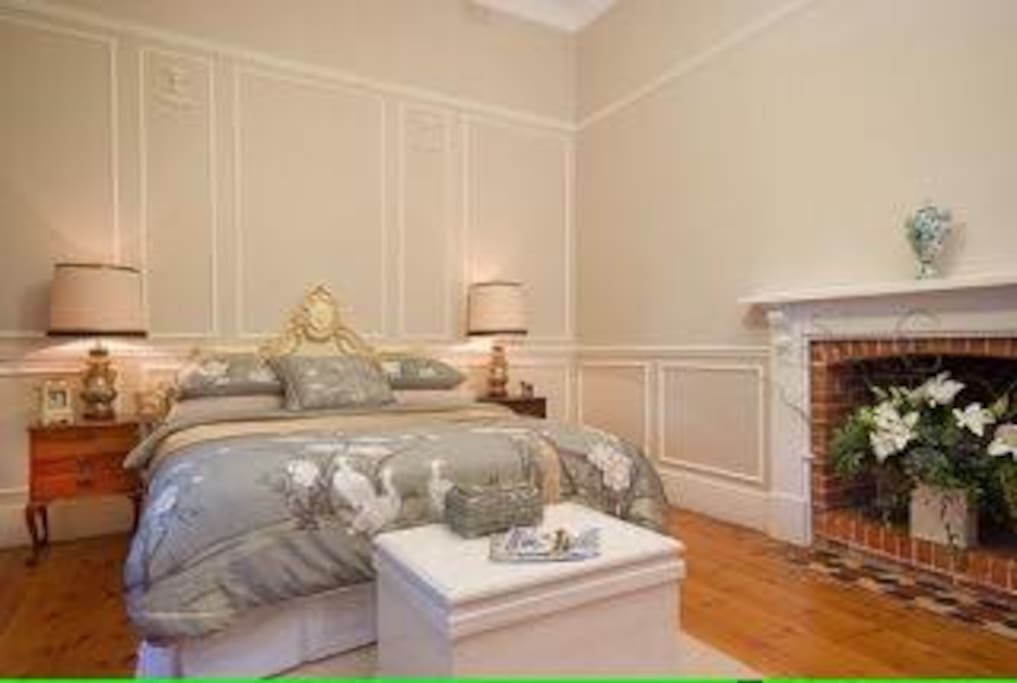 Your opulent king bed in your huge bedroom