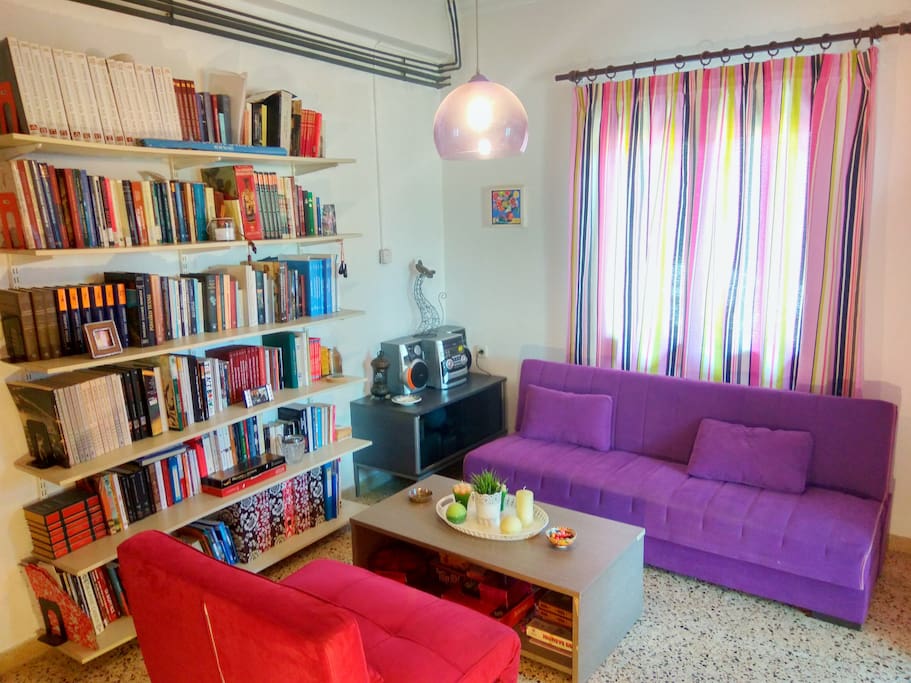 My library, which I am very proud of. You can also see the sofa and the sofa chair, both capable to transform to extra beds.