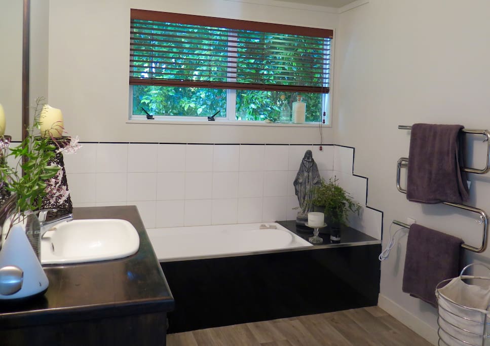 Main bathroom with bath and separate shower.