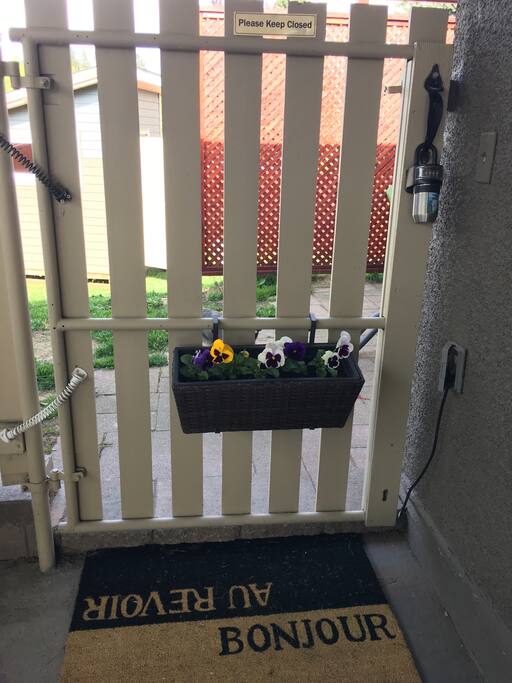 Welcome! This is the entrance gate in the carport. Key lock box available to make check in simple.