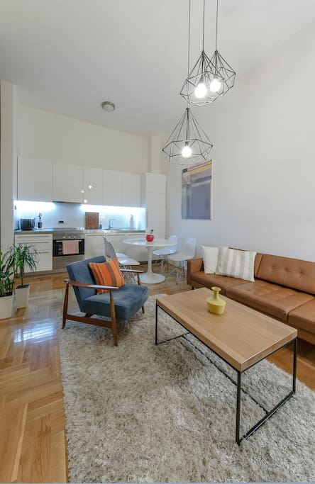 Living room with the kitchen and dining table