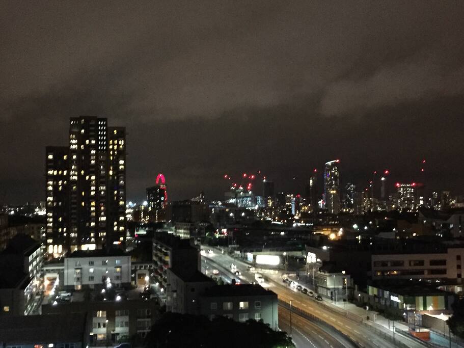 North you look towards Stratford and can see parts of Olympic Stadium/Village including top of the Anish Kapoor ''Orbit'' sculpture which looks lovely lit up red at night.