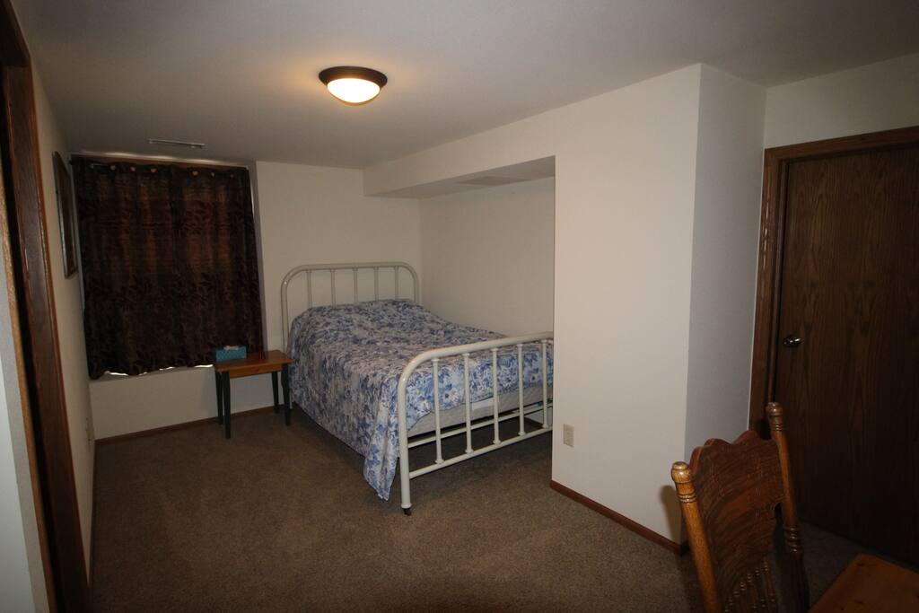 The 4th bedroom downstairs features a walk- in closet with an attached full bath.