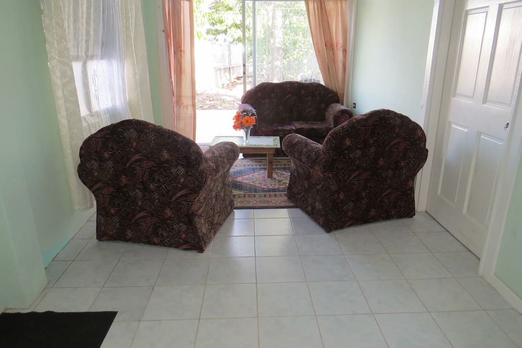 Spacious sitting area with sliding patio doors to sitting area and garden
