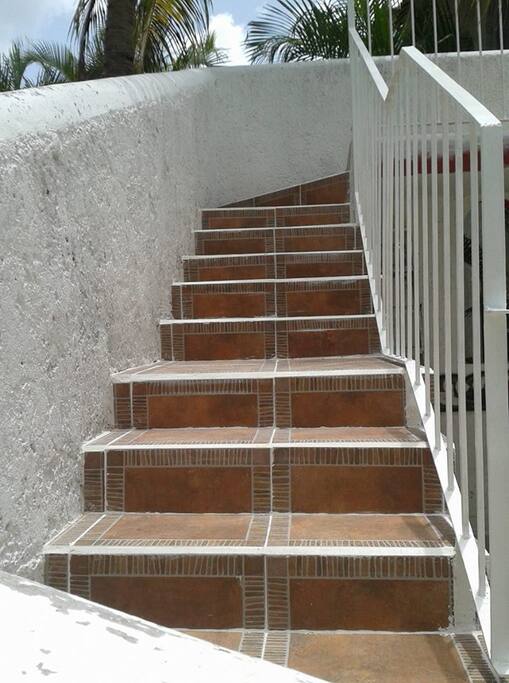 The non-slip stairs with railing lead to the main entrance of the Master Suite. You will be the only guests using this staircase and the upstairs patio.
