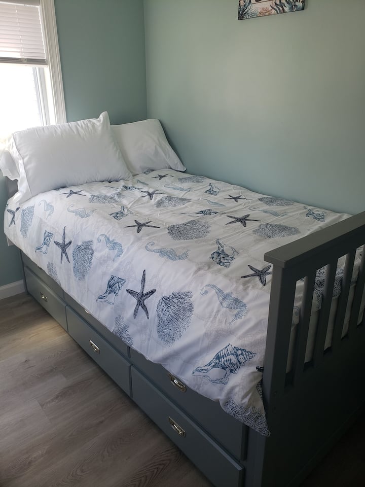 Trundle bed with storage and another bed underneath 