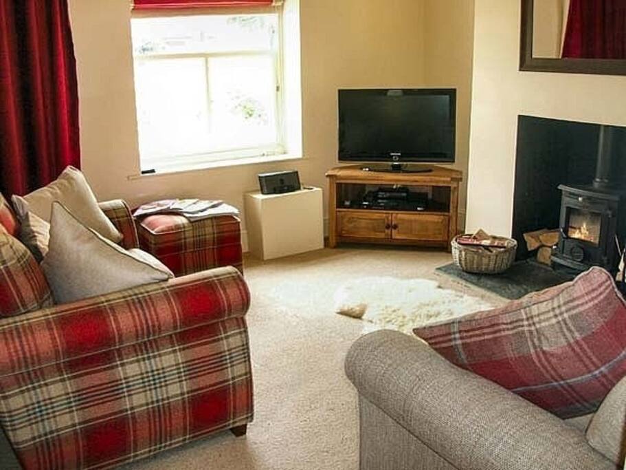Lounge with cosy woodburner
