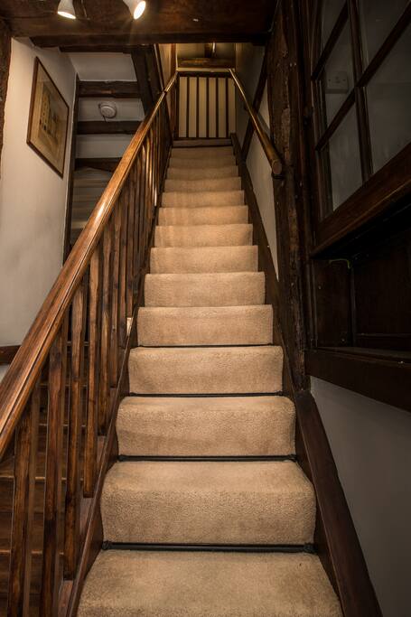 The steep staircase leading to the studio in the attic.