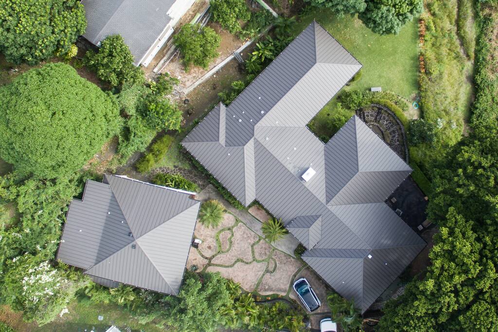 Aerial view of the property; driveway and overall property layout