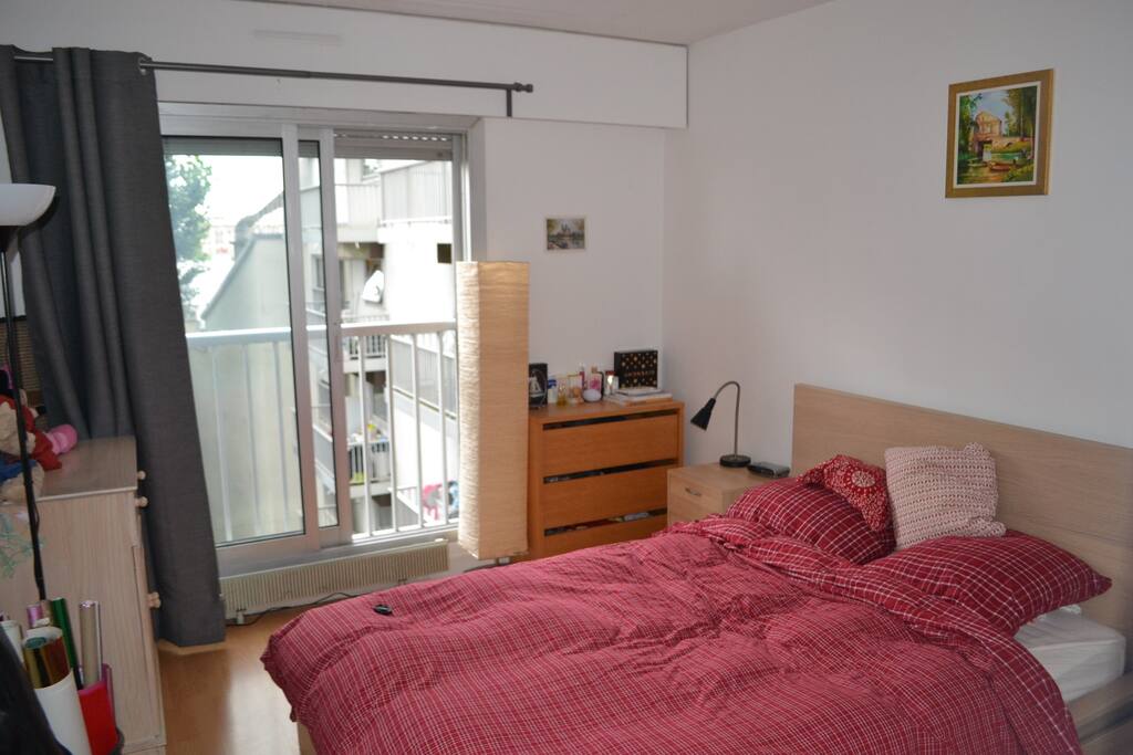 Bedroom with double bed and big windows