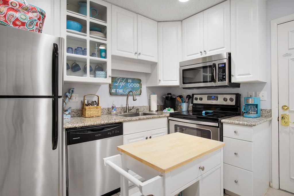 Kitchen with granite countertops and stainless steel appliances.