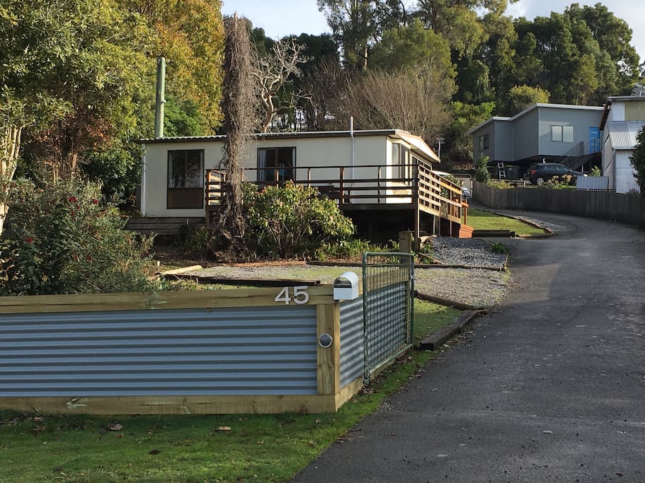 Street view with parking area to the front of the unit.