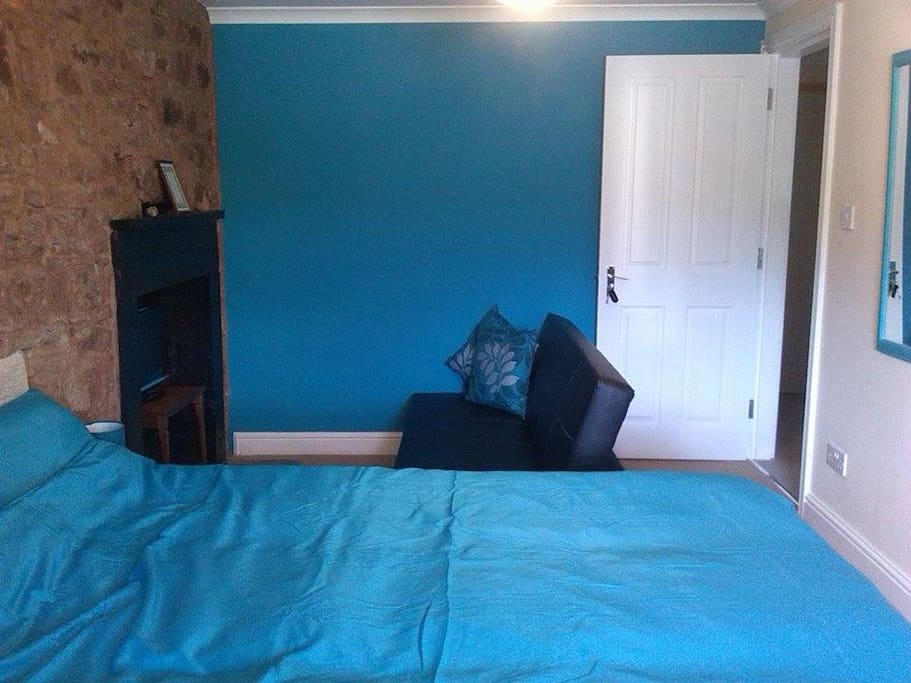 Sofabed lounging area. Key to your room.