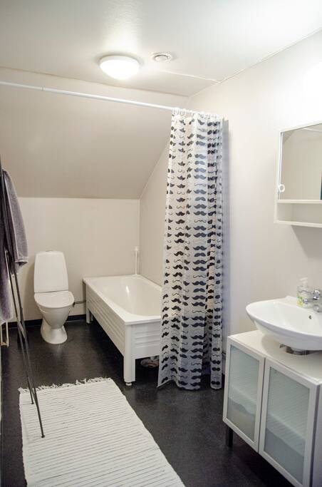 First door to your right is a bathroom with a tub for all you bathers.