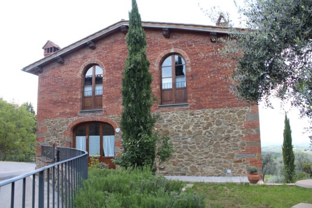 A view of the front entrance with the two en-suite bedrooms on the upper floor.