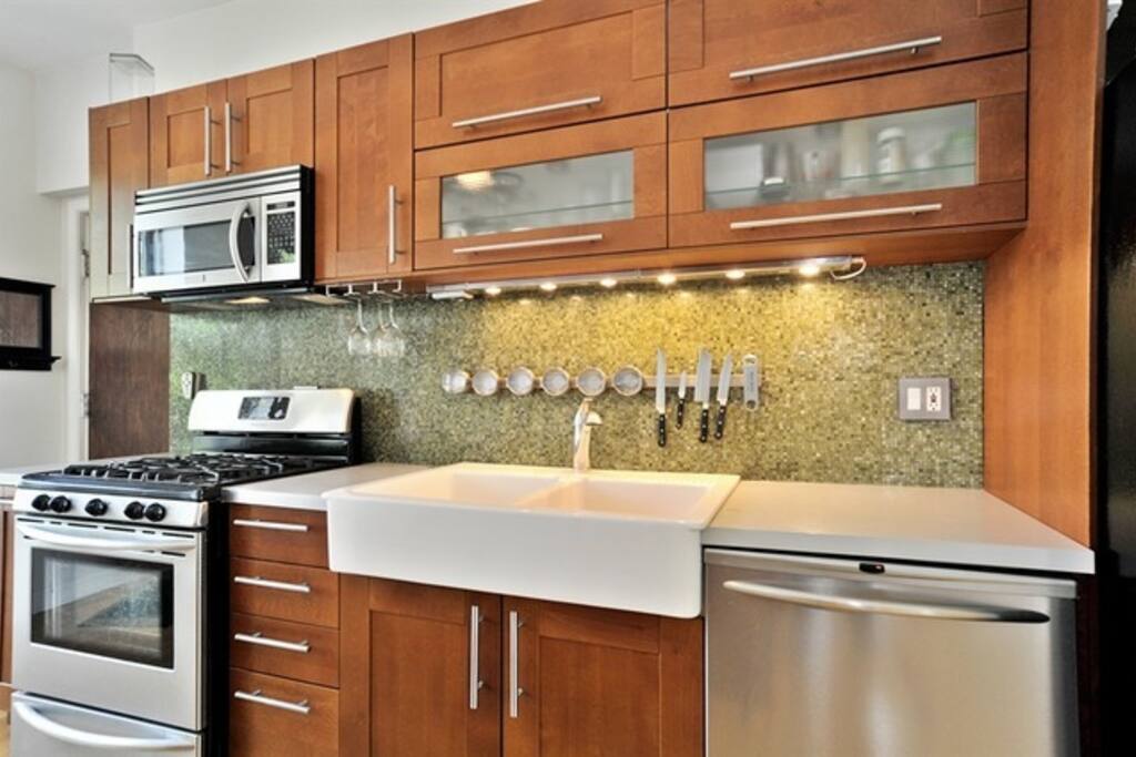 Large stove, microwave, sink and dishwasher.