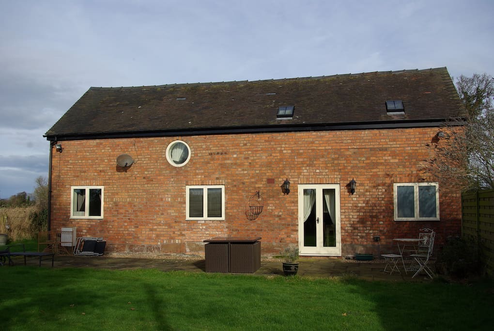 A south-facing sun trap with well-equipped patio and French doors to kitchen-diner.