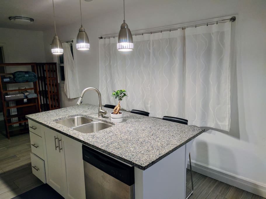 Enjoy the bar while the other person cooks!