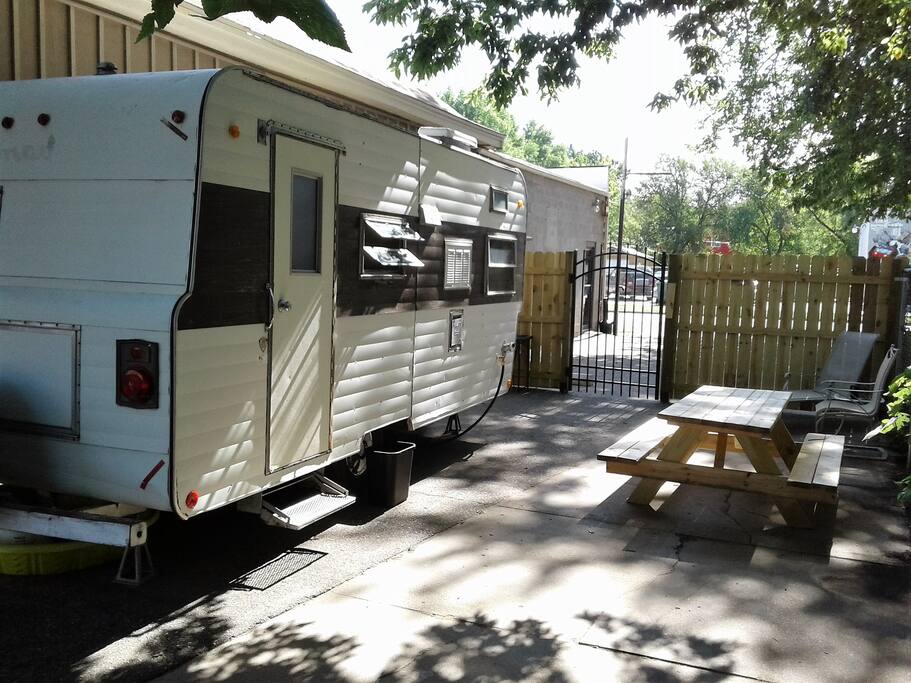 Private fenced area with gate to parking