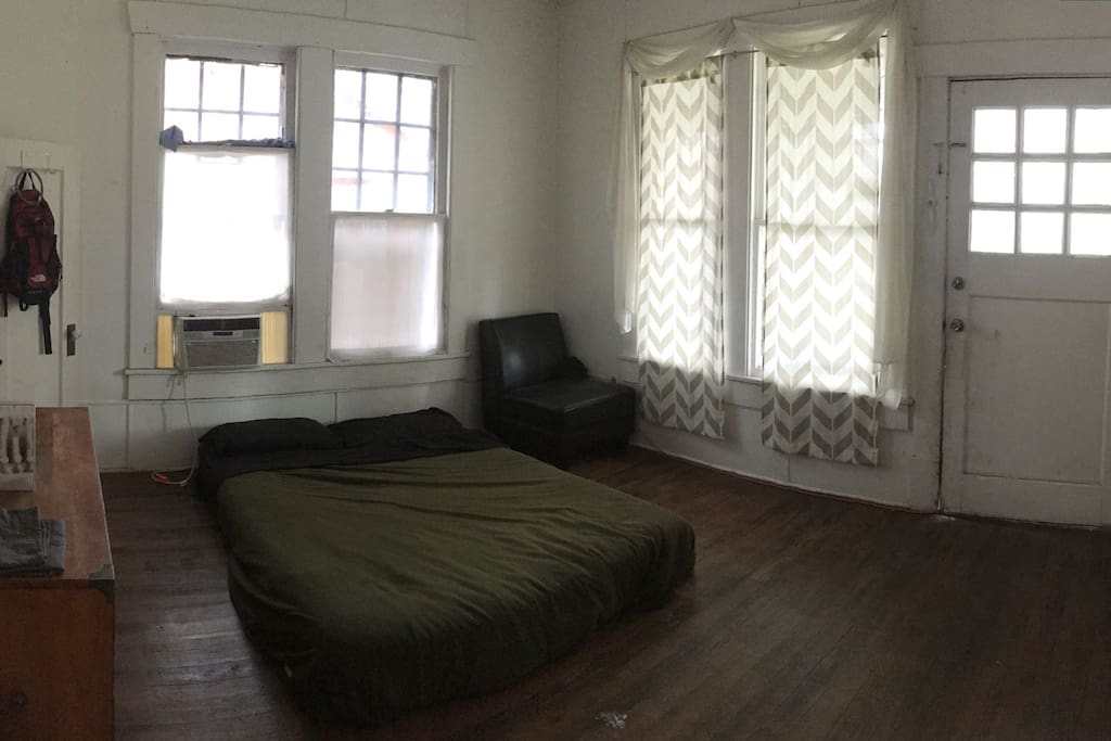 Front door access to E Cesar Chavez St, shared porch with neighbors outside.