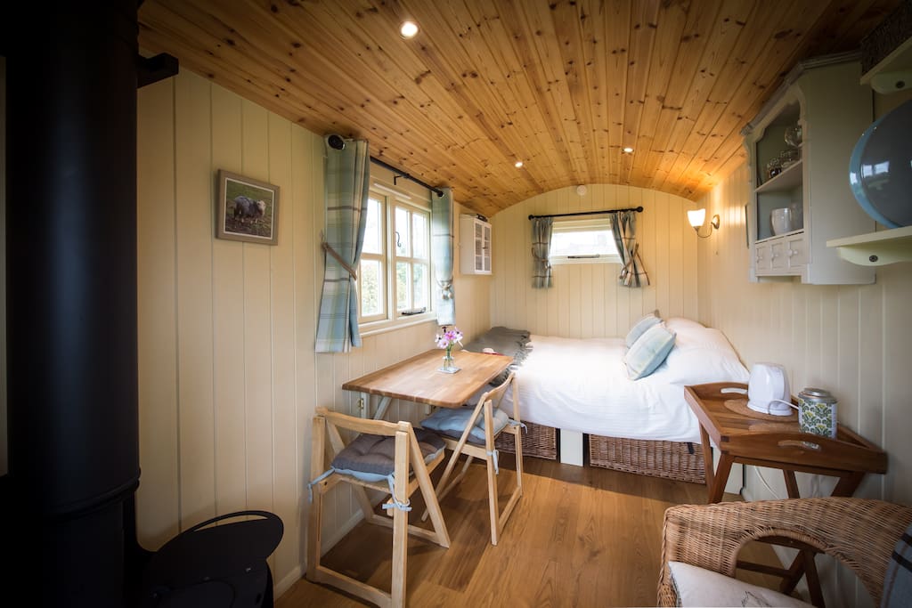 Log stove, as well as electric heater