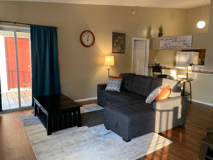 Open gathering area has 46 inch flat screen TV and streaming box. Couch converts to full-size bed.