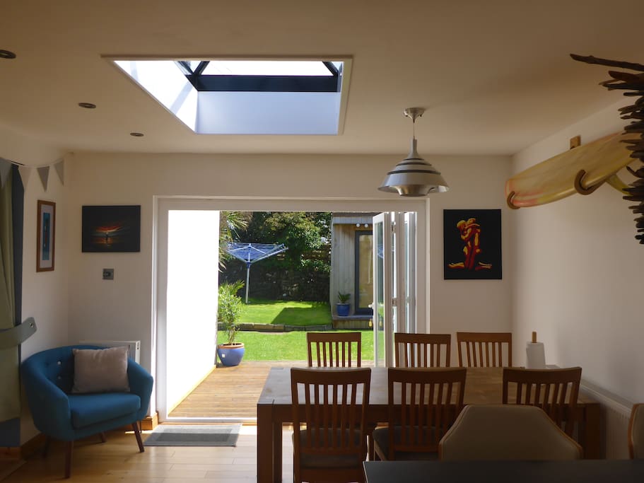 Large dining table for 8 people with bi-fold access to large private garden. Perfect for summer dining.