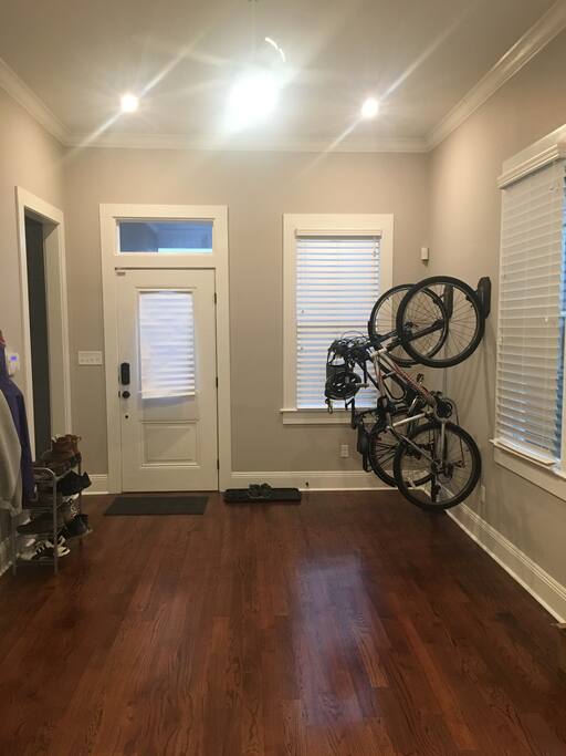 Shows front door entrance. On the left side of the photo, you can see the door way to the guest bedroom and private bathroom.