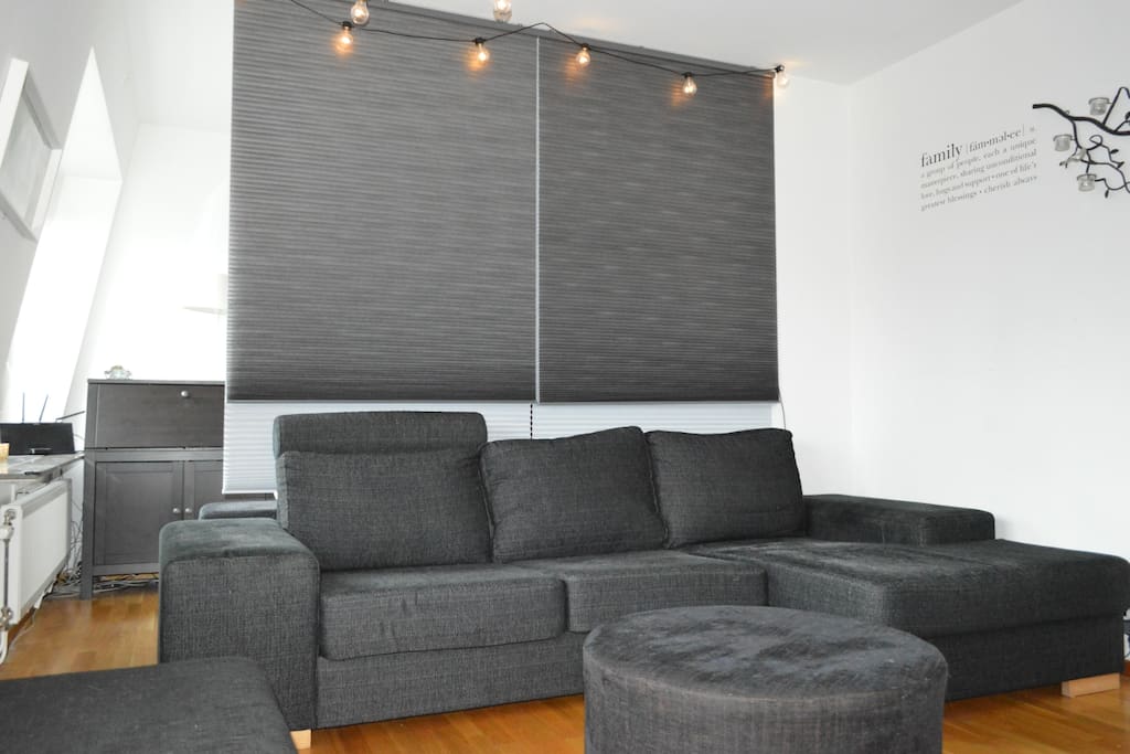 The apartment’s living room is large and therefore divided into two spaces. The part that is a living room has a large sofa and a large flat screen-TV. The sofa is very comfortable to sleep in. Two people have even slept in it at the same time, but that is however not so comfortable.