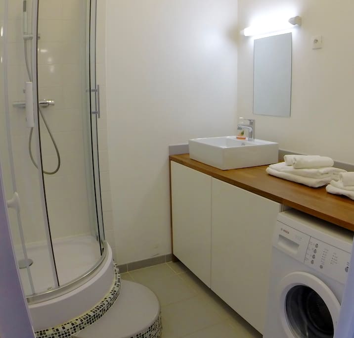 New bathroom with shower and BOSCH washing machine