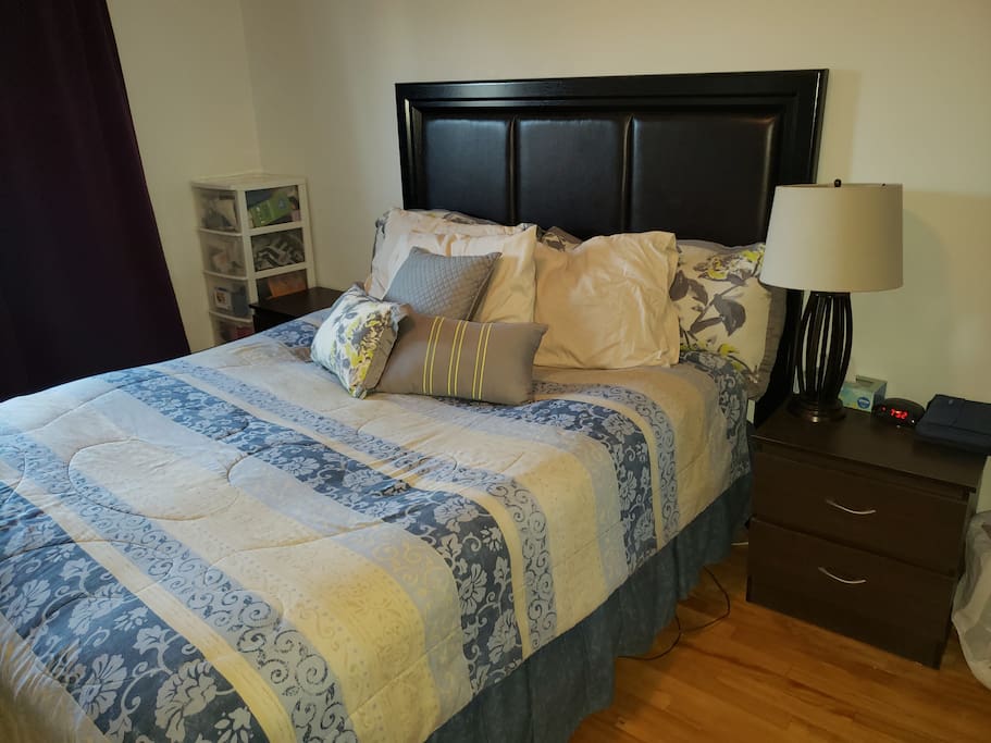 Queen size bed with A/C in room