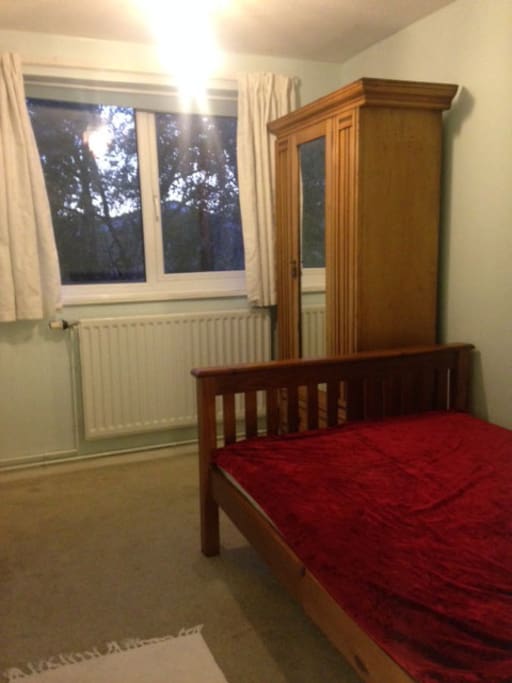 Bed, wardrobe and window