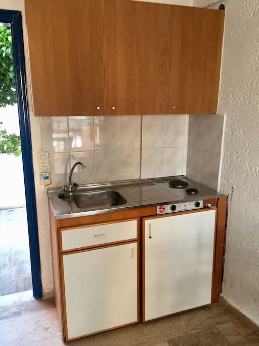 Kitchenette, mini fridge and cupboards