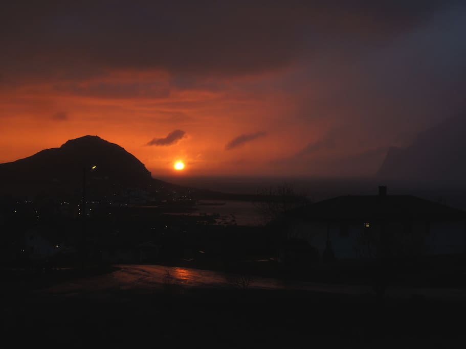 The midnight Sun and the rainfall as seen from Bjorvika.