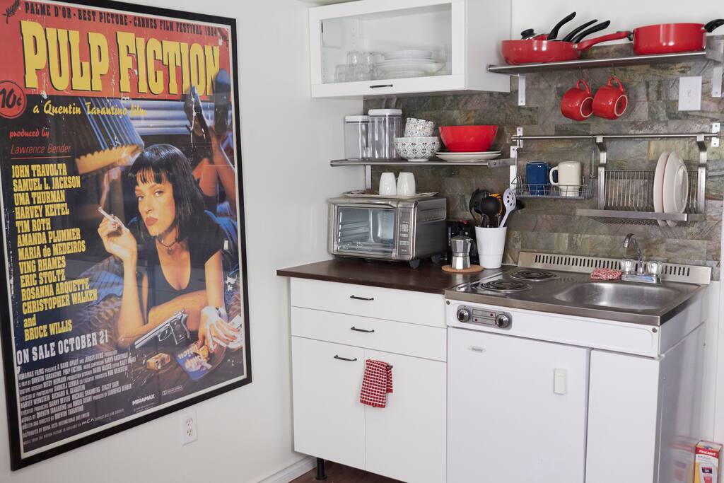 Kitchen area with fridge/sink/stove top (2 elements), toaster oven, kettle, percolator, pots, pans, etc...