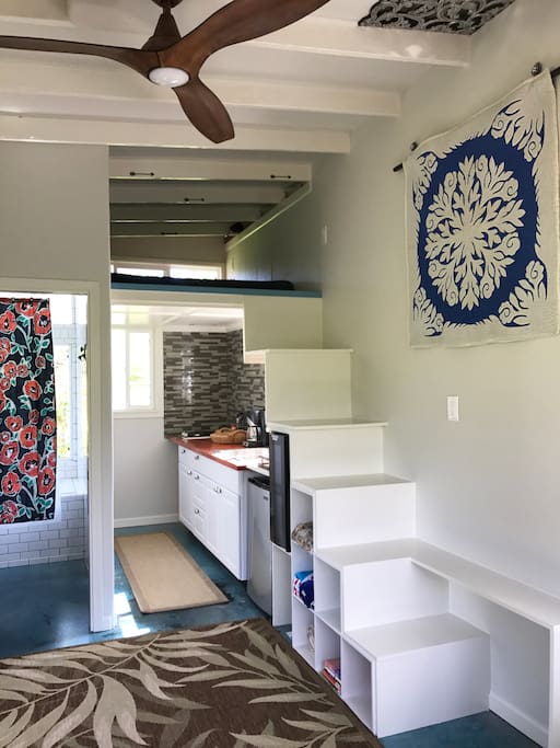 Bathroom to the left.
Kitchen to the right.
Bed is above the Kitchen