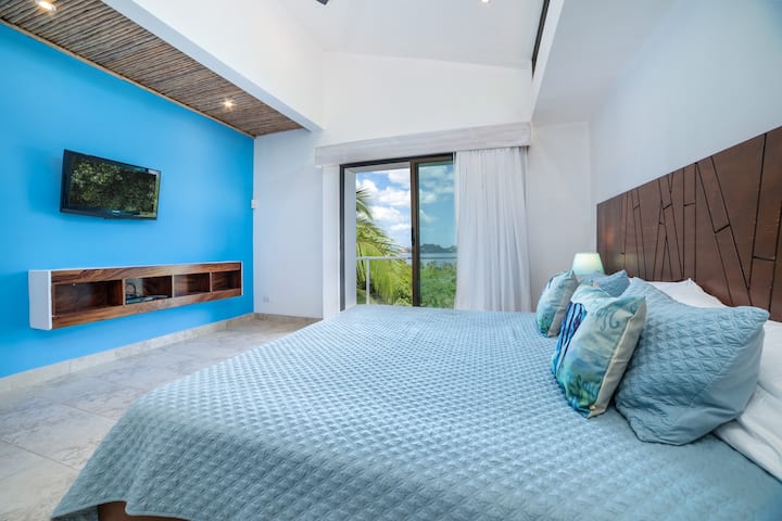 Master bedroom with king firm bed and Oceanview.